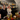 two women smiling behind a bar with 5 cocktails in front of them at at fine art bartending school