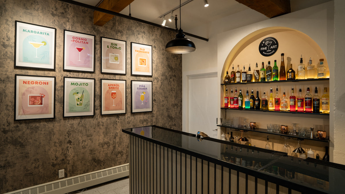 Modern fine art bartending school bar interior with tables, chairs, and shelves displaying bottles