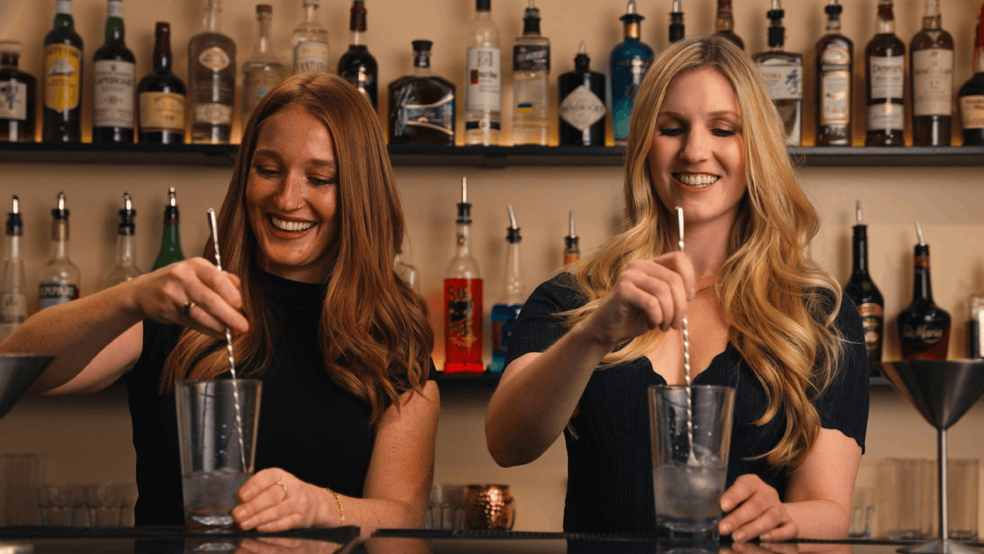 Student behind the 22-foot bar at Fine Art Bartending School Vancouver