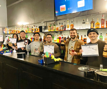 Students receiving their certificates in the classroom at the Fine Art Bartending School near North Vancouver, British Columbia