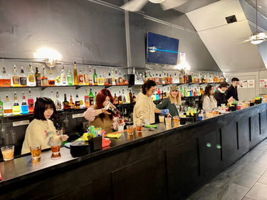 Students learning how to mix drinks in the classroom at The Fine Art Bartending School near Coquitlam, British Columbia